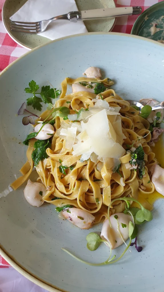 Baby calamari, garlic and lemon tagliatelle with shaved parmesan and fresh herbs